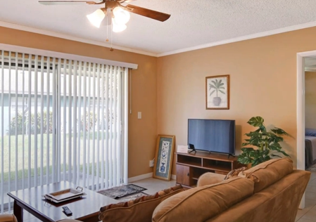 Indoor view of unit with couch, tv, and sliding glass door