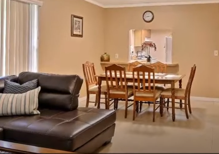 Inside view of unit's couch and dining room table